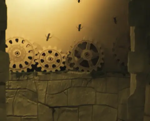 Gears of a mechanism in a stone wall of the temple