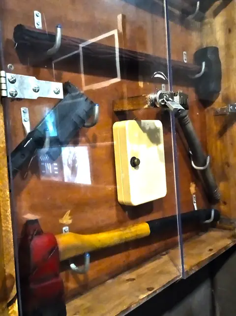 Glass cabinet with an axe and a crowbar, in Oh No! Zombies